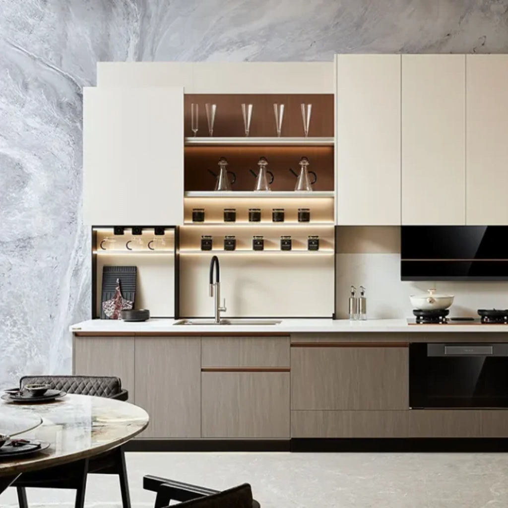 Modern kitchen interior with beige cabinets, integrated appliances, and open shelves displaying glassware and kitchen essentials